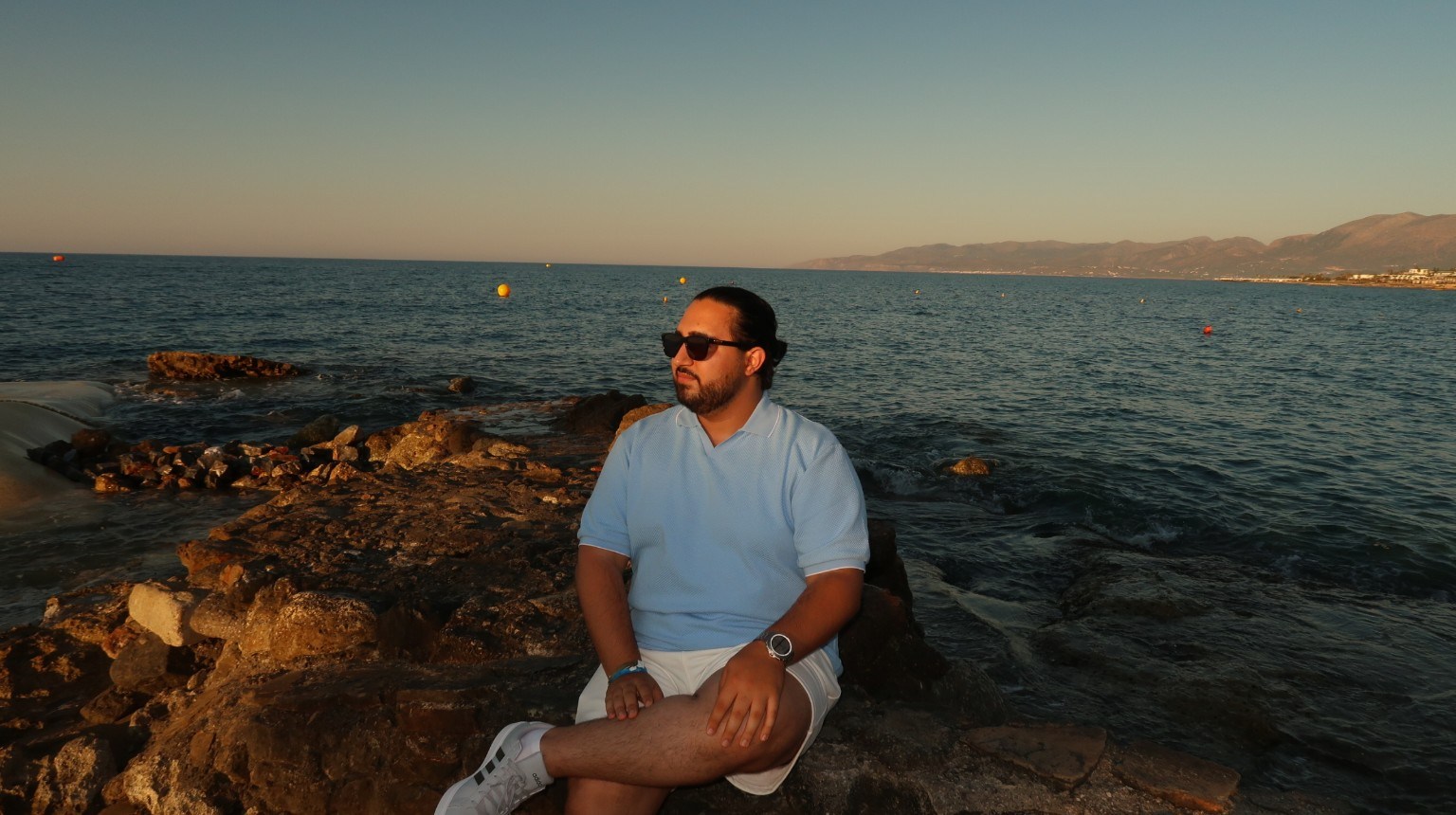 Danial Shiekho, personal, seated by the sea
