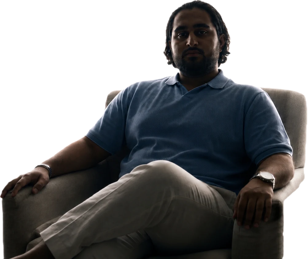 Danial Shiekho, seated, thoughtful